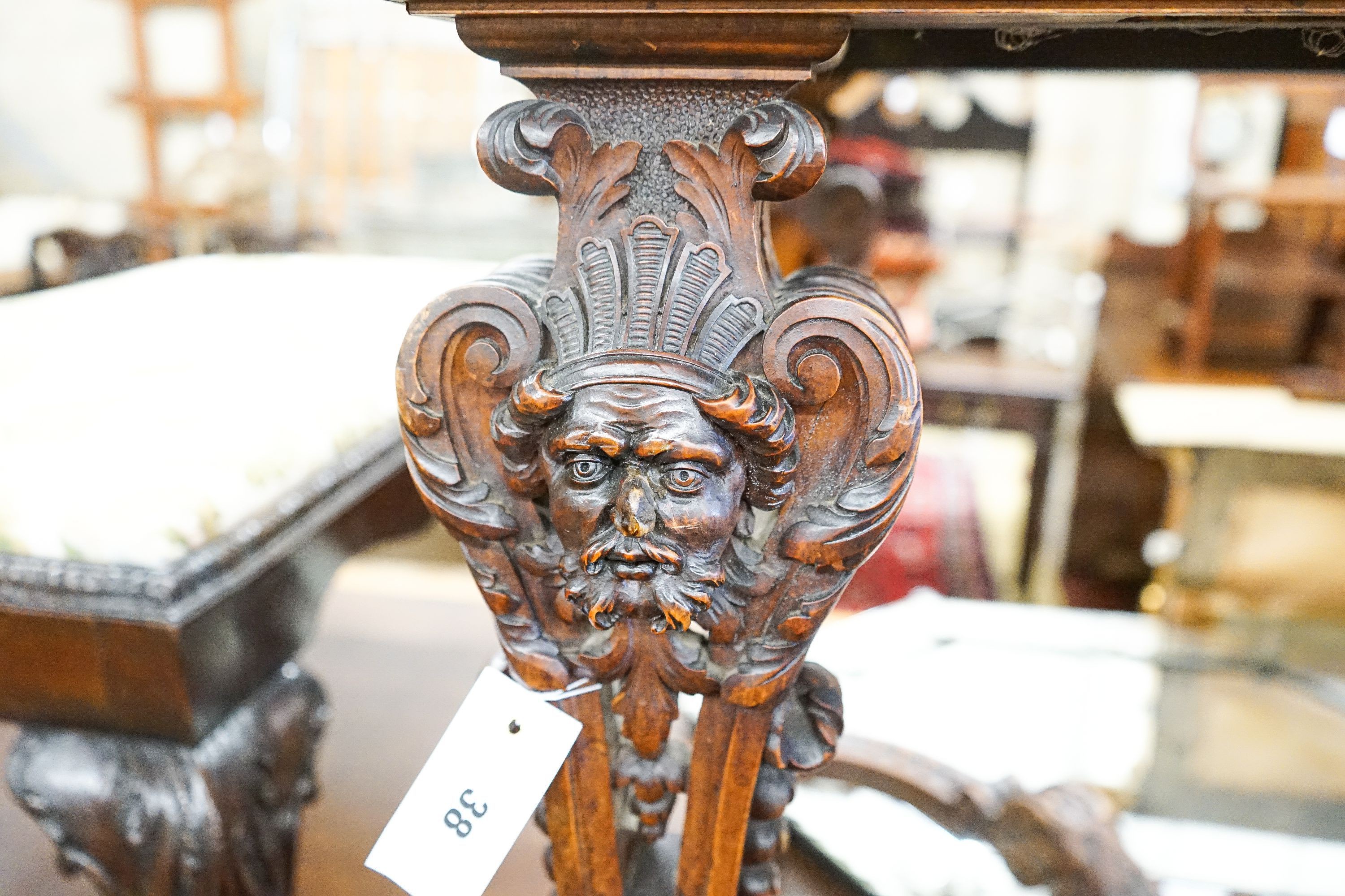 A Flemish carved walnut and beech centre table, width 100cm, depth 63cm, height 77cm